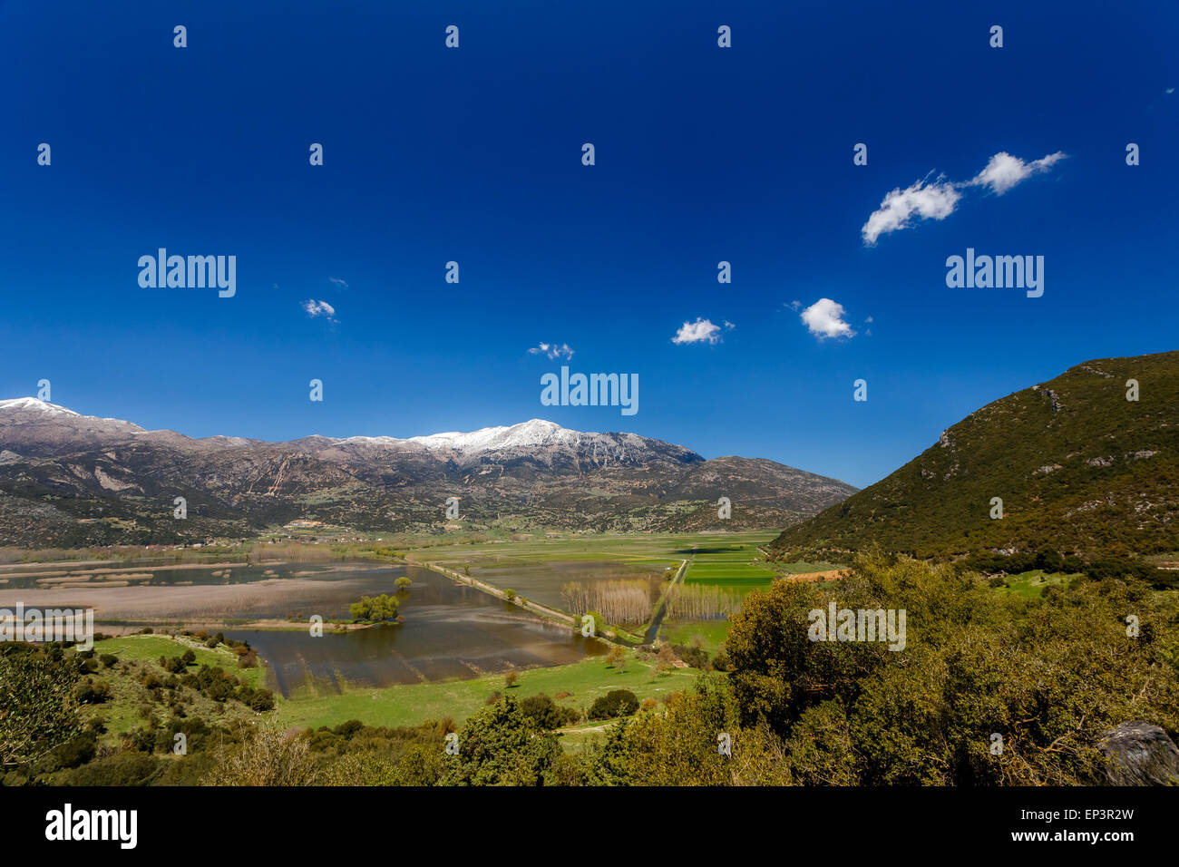 Stymfalia Stymfalia lake in Corinthia prefecture, Greece with the snowy mountains ...