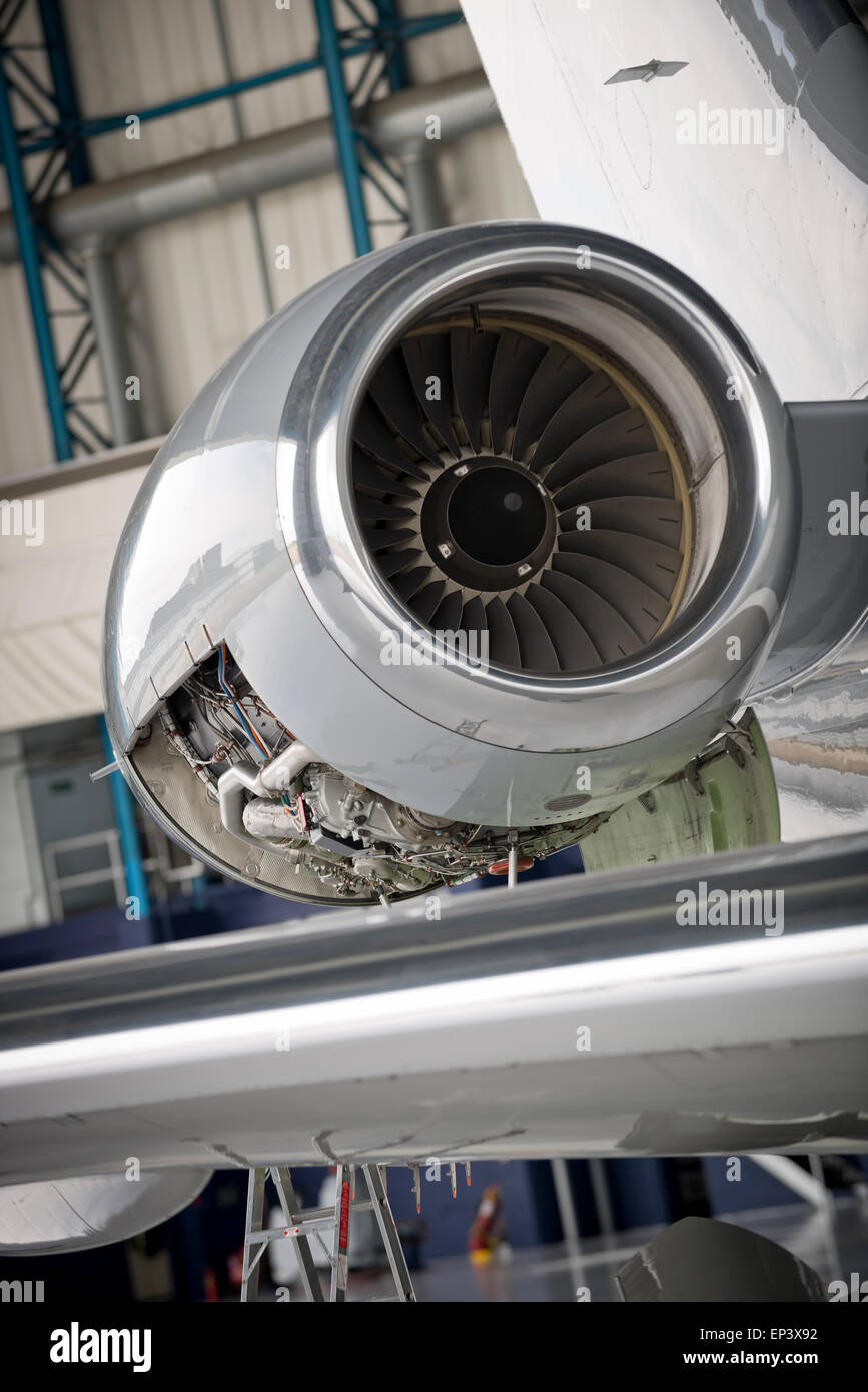 Jet airplane's engine with cowling removed for maintenance Stock Photo