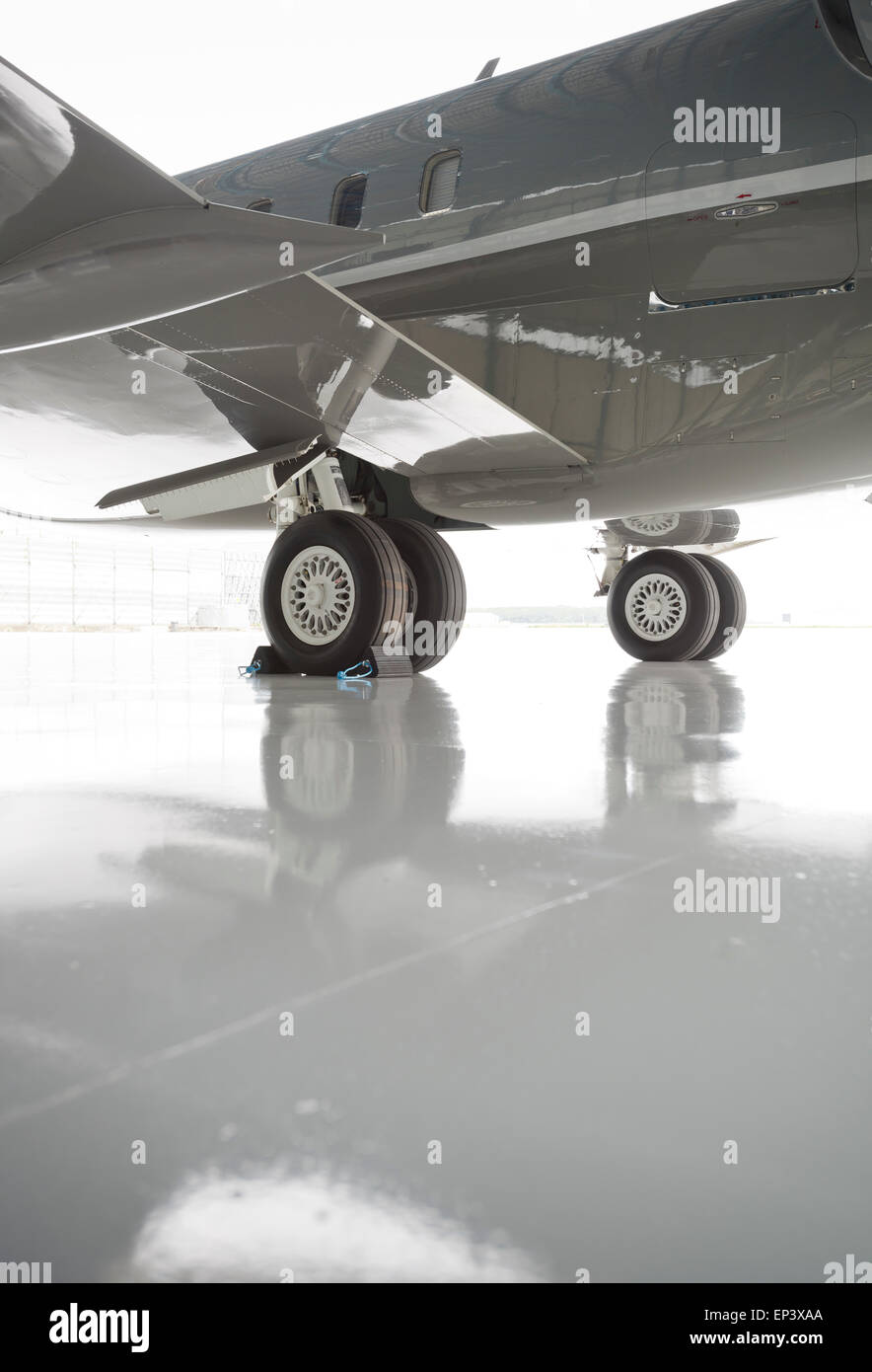 Wheel chocks on an airplane Stock Photo