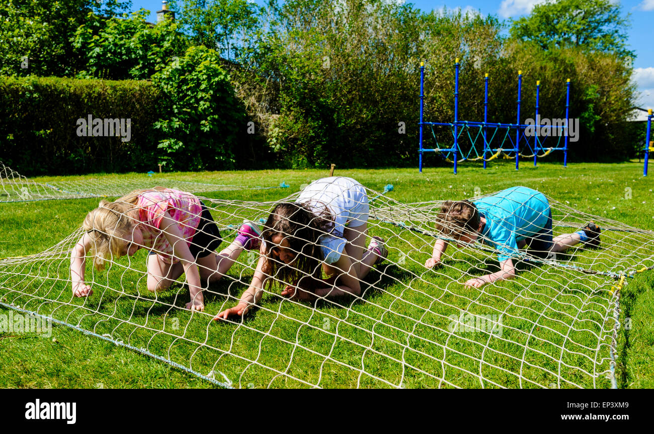 Children take part in an obstacle race during a local village day in Scotland Stock Photo