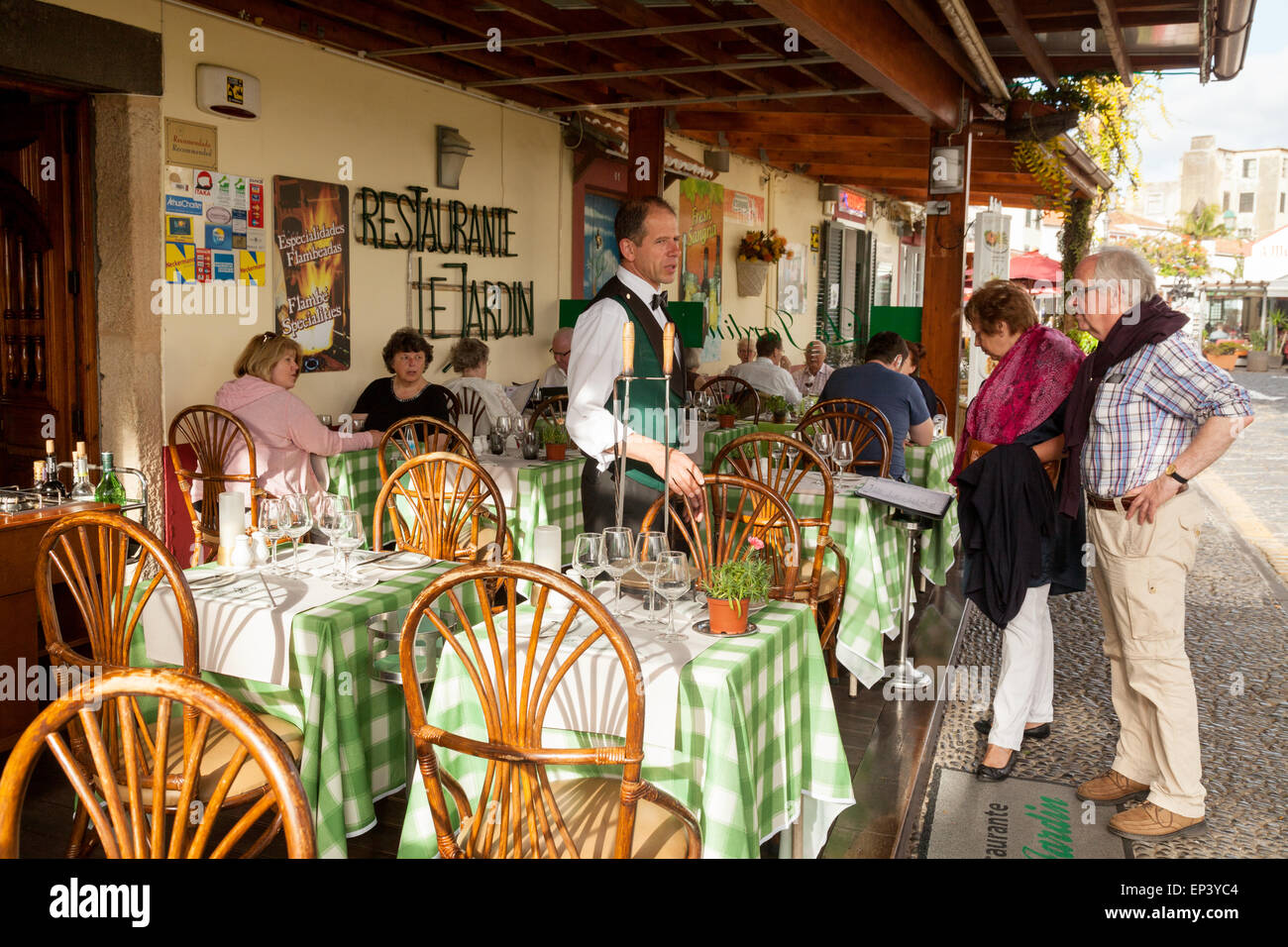 madeira restaurant; Waiter and customers at a restaurant in Funchal old town ( Zona Velha ), Funchal Madeira, Europe Stock Photo