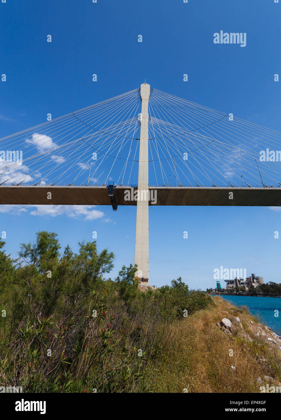 The new cable bridge of Chalkida, Greece that connects the island of Evia  with mainland Greece against a blue sky Stock Photo - Alamy