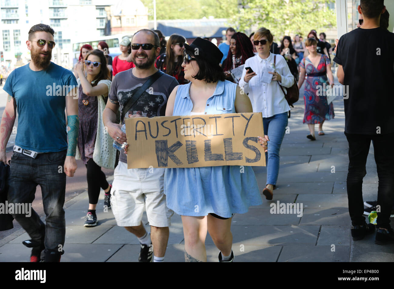 Bristol, UK. 13th May, 2015. Woman holds 'Austerity Kills' banner Credit:  Rob Hawkins/Alamy Live News Stock Photo
