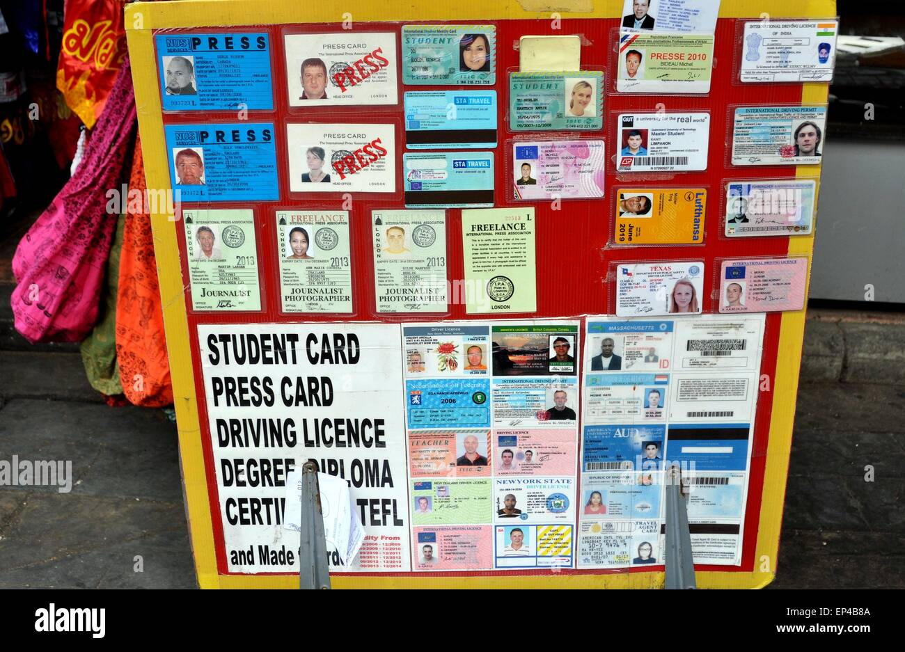 Bangkok, Thailand:  Khao San Road is the place to go for custom-made fake student I.D.'s,  press cards, diplomas, etc. Stock Photo