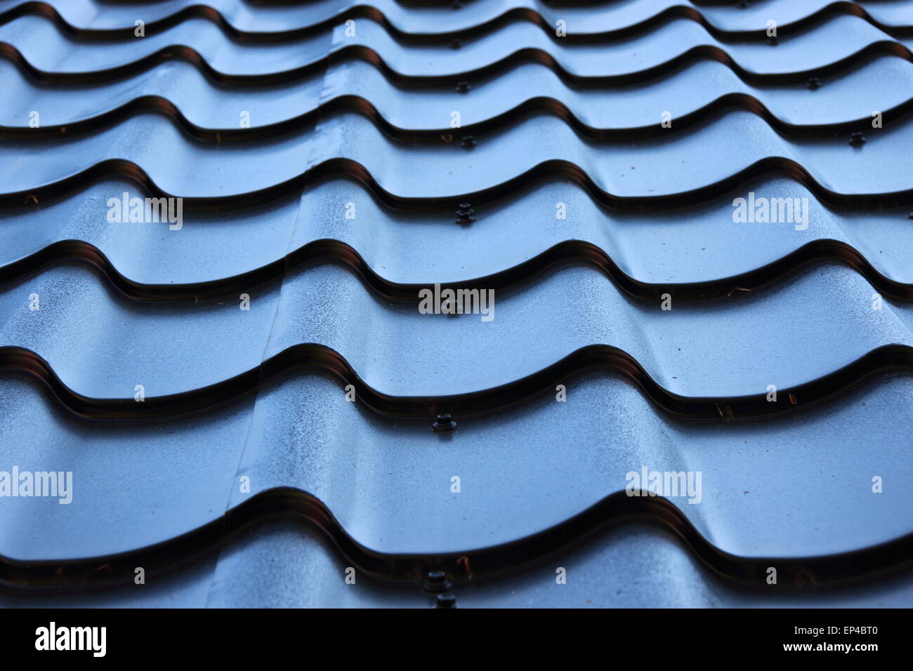 Detail of curved black metal roof Stock Photo