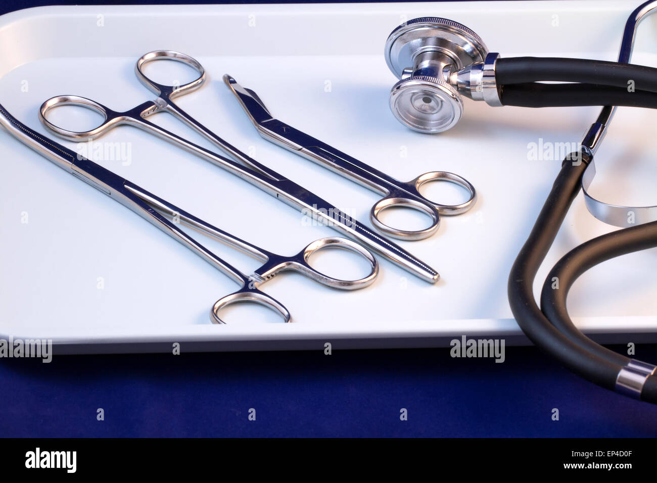 Medical tray with various tools, hemostat, bandage scissors and stethoscope Stock Photo Alamy