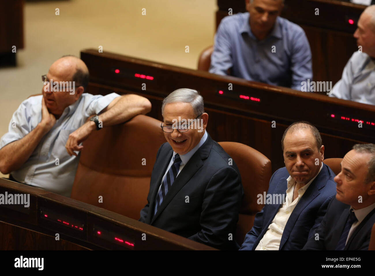 (150513) -- JERUSALEM, May 13, 2015 (Xinhua) -- Israeli Prime Minister Benjamin Netanyahu (C, front) reacts during a vote in the Israeli Knesset (parliament) in Jerusalem, on May 13, 2015. The Israeli Knesset (parliament) Wednesday voted in favor of a bill that will empower Prime Minister Benjamin Netanyahu to enlarge the number of cabinet positions in the new coalition government. (Xinhua/JINI) Stock Photo