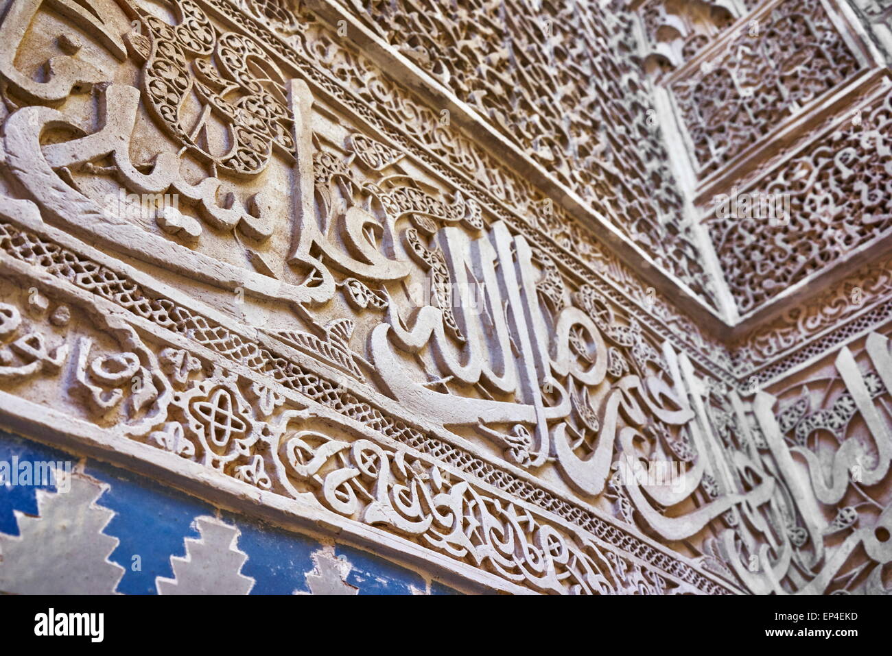 Fez, Medersa Bou Inania, Koranic school. Detail of the Zellij calligraphic frieze at courtyard. Morocco Stock Photo