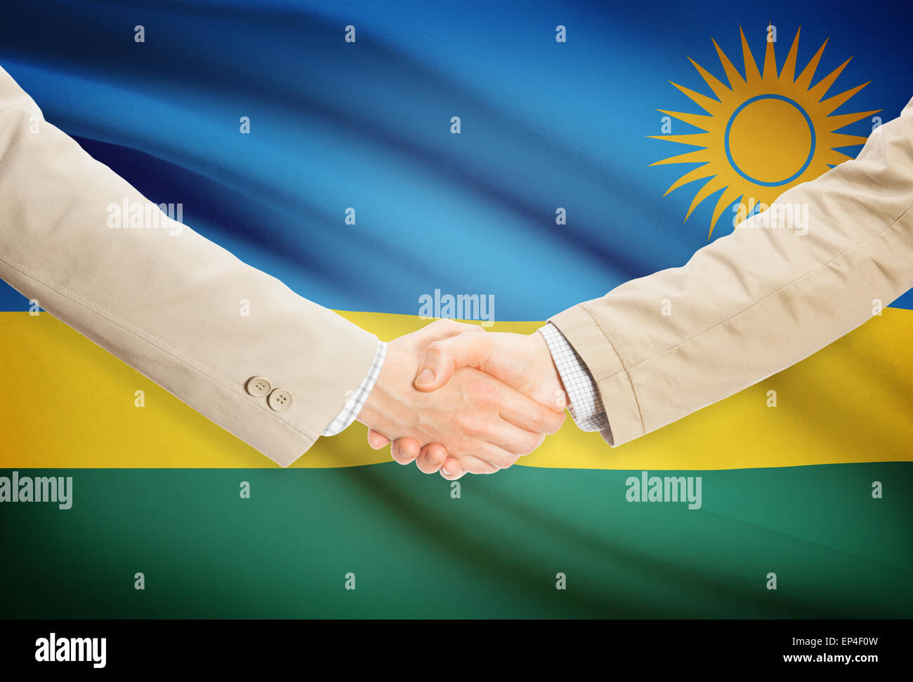 Businessmen shaking hands with flag on background - Rwanda Stock Photo ...