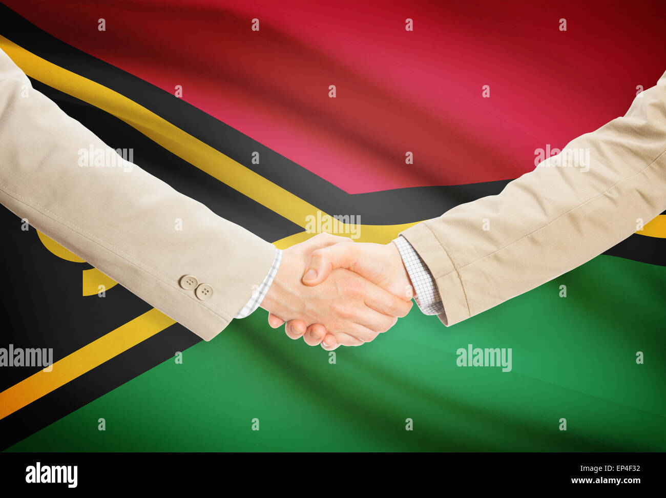 Businessmen shaking hands with flag on background - Vanuatu Stock Photo