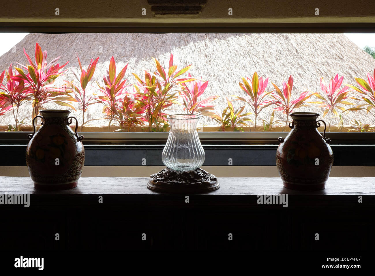 Mexican vases in front of ti leaves and a thatched roof at the Fiesta Americana resort, Puerto Vallarta, Mexico Stock Photo