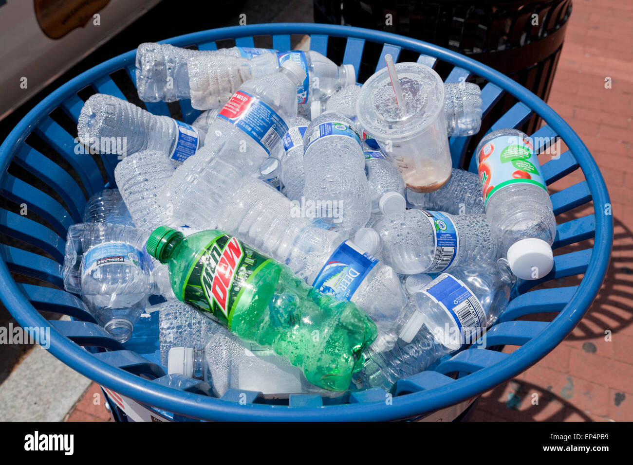 Plastic water bottles in public outdoor recycle bin - USA Stock Photo