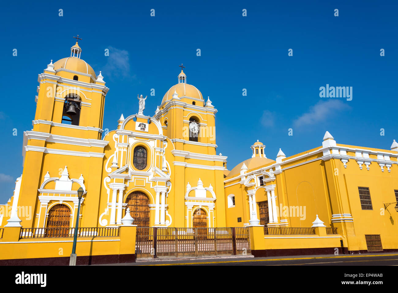 Magnificent yellow cathedral with a beautiful blue sky in Trujillo, Peru Stock Photo