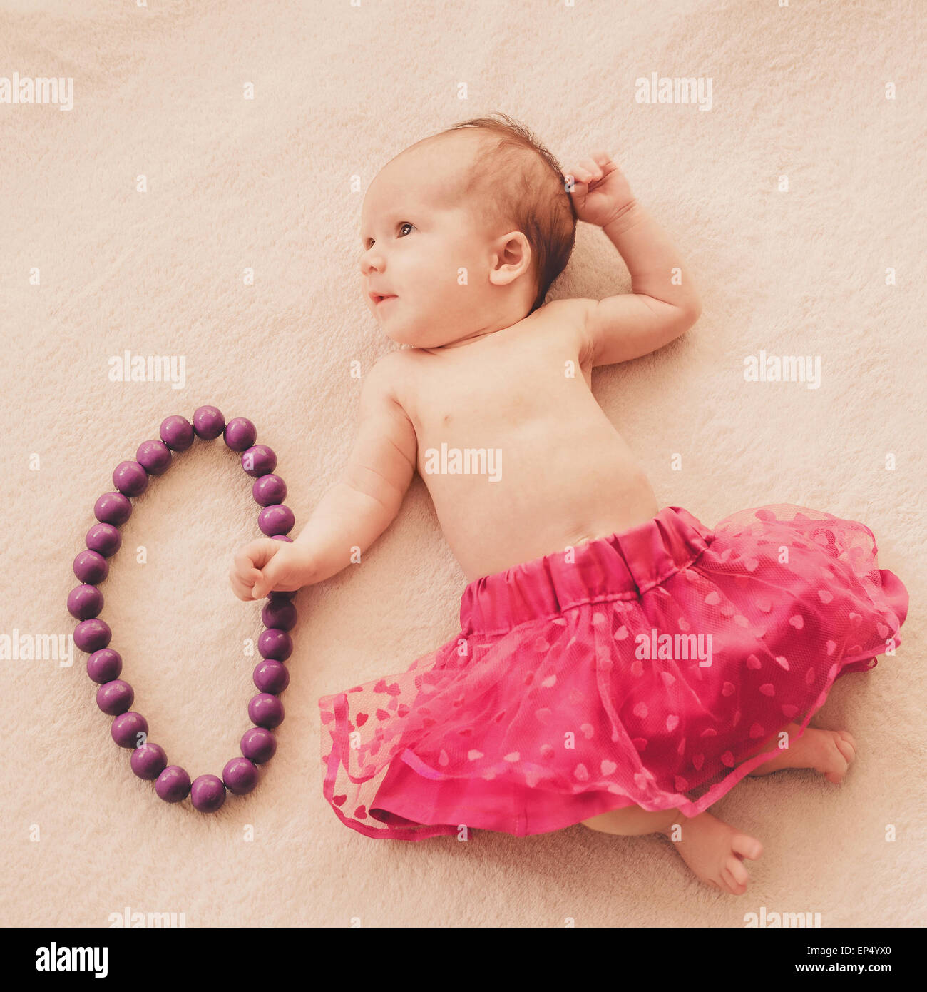 newborn baby girl in skirt Stock Photo