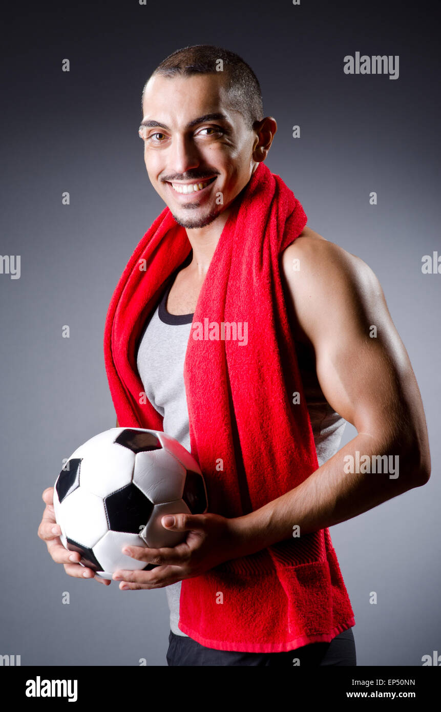 Football player with ball and towel Stock Photo Alamy