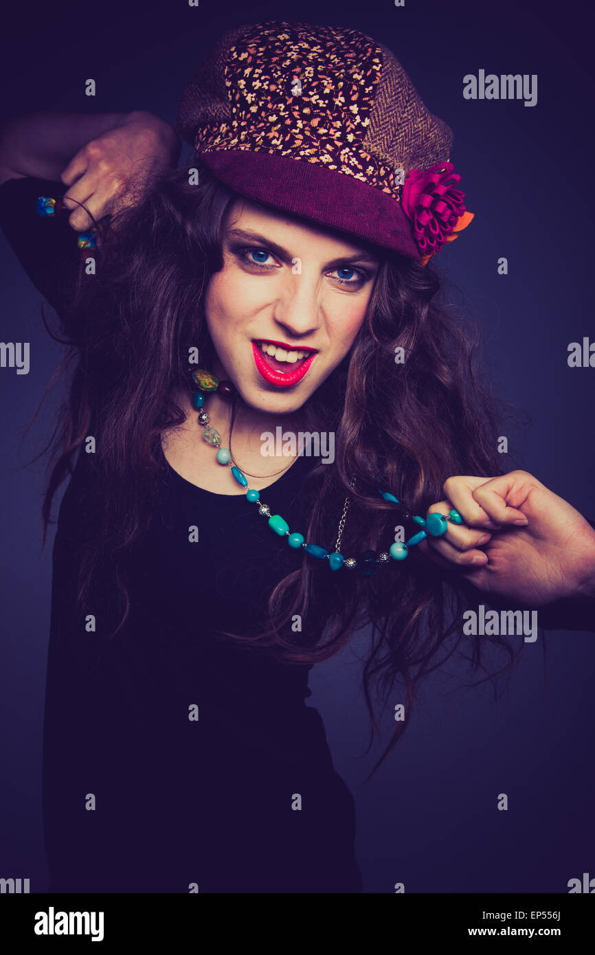 Young woman wearing a hat and necklace. Stock Photo