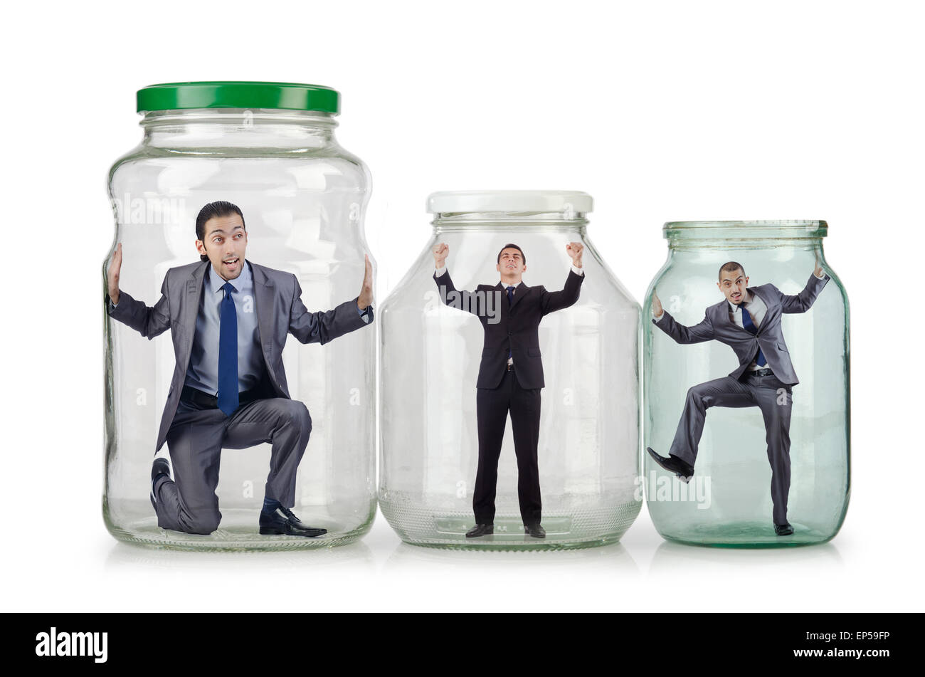 Young businessman in glass jar Stock Photo