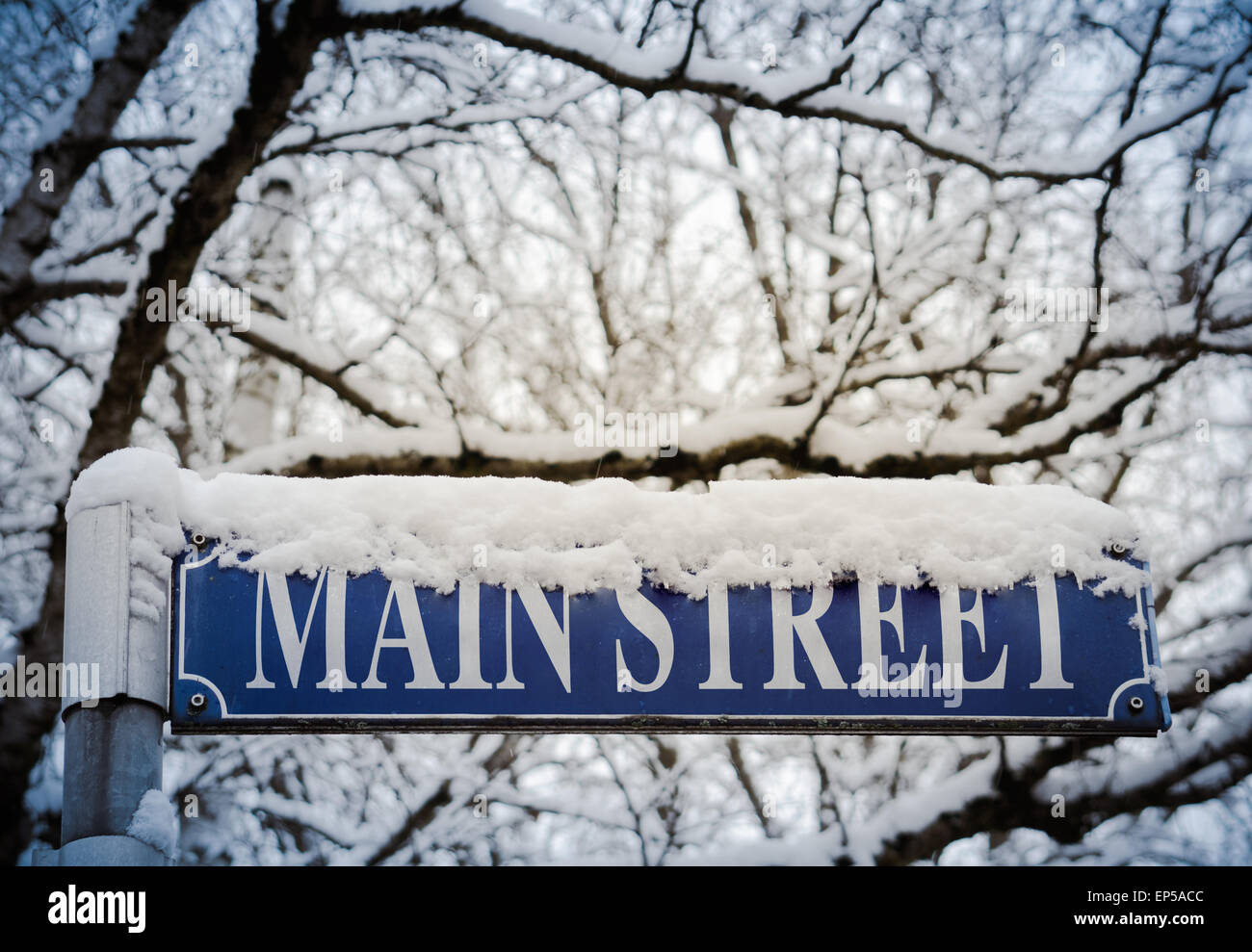 Retro Style Image Of Snow On A Sign For Main Street Stock Photo