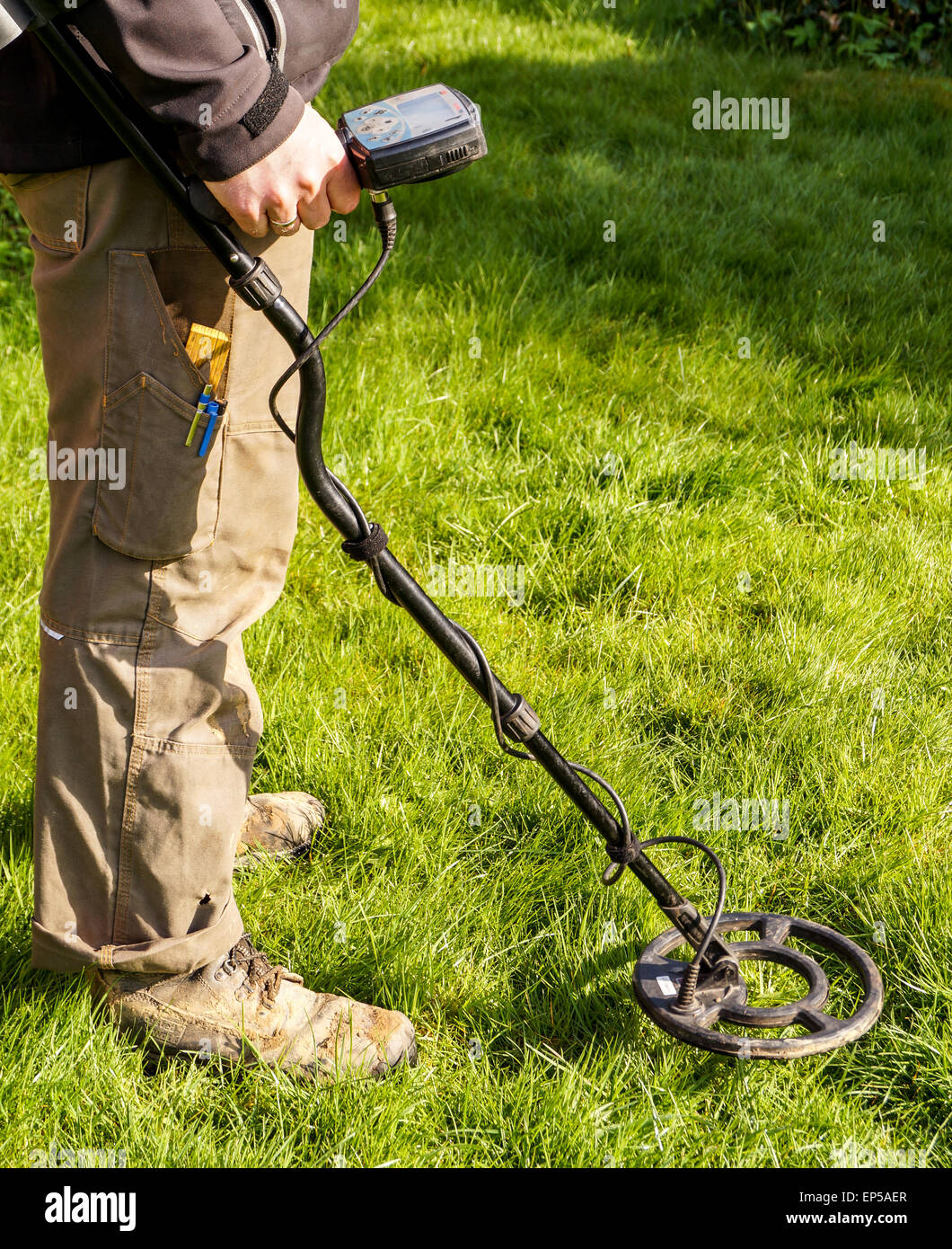 Metal Detector. Man with metal detector , he uses it to find