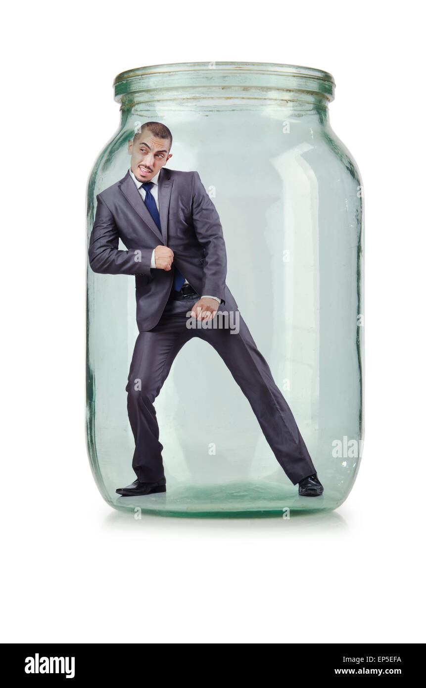 Young businessman in glass jar Stock Photo