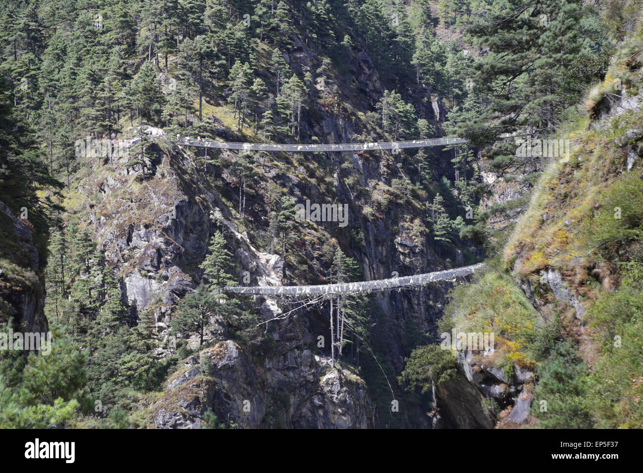 The Everest Base Camp trek crosses the Dudh Kosi River over new wire suspension bridges on the way to Namche Bazaar, Stock Photo