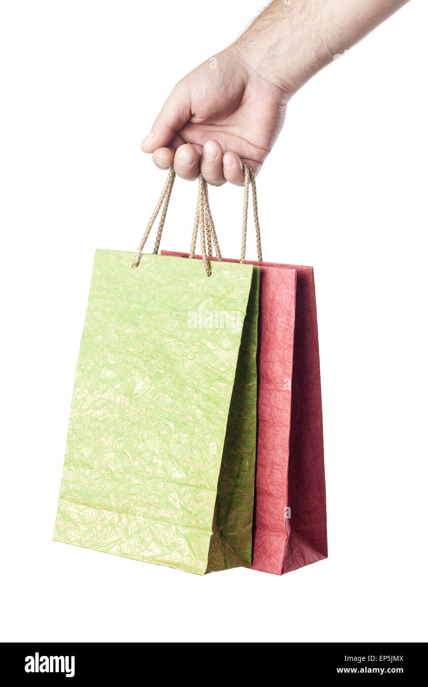 male hand holding two shopping bags isolated Stock Photo