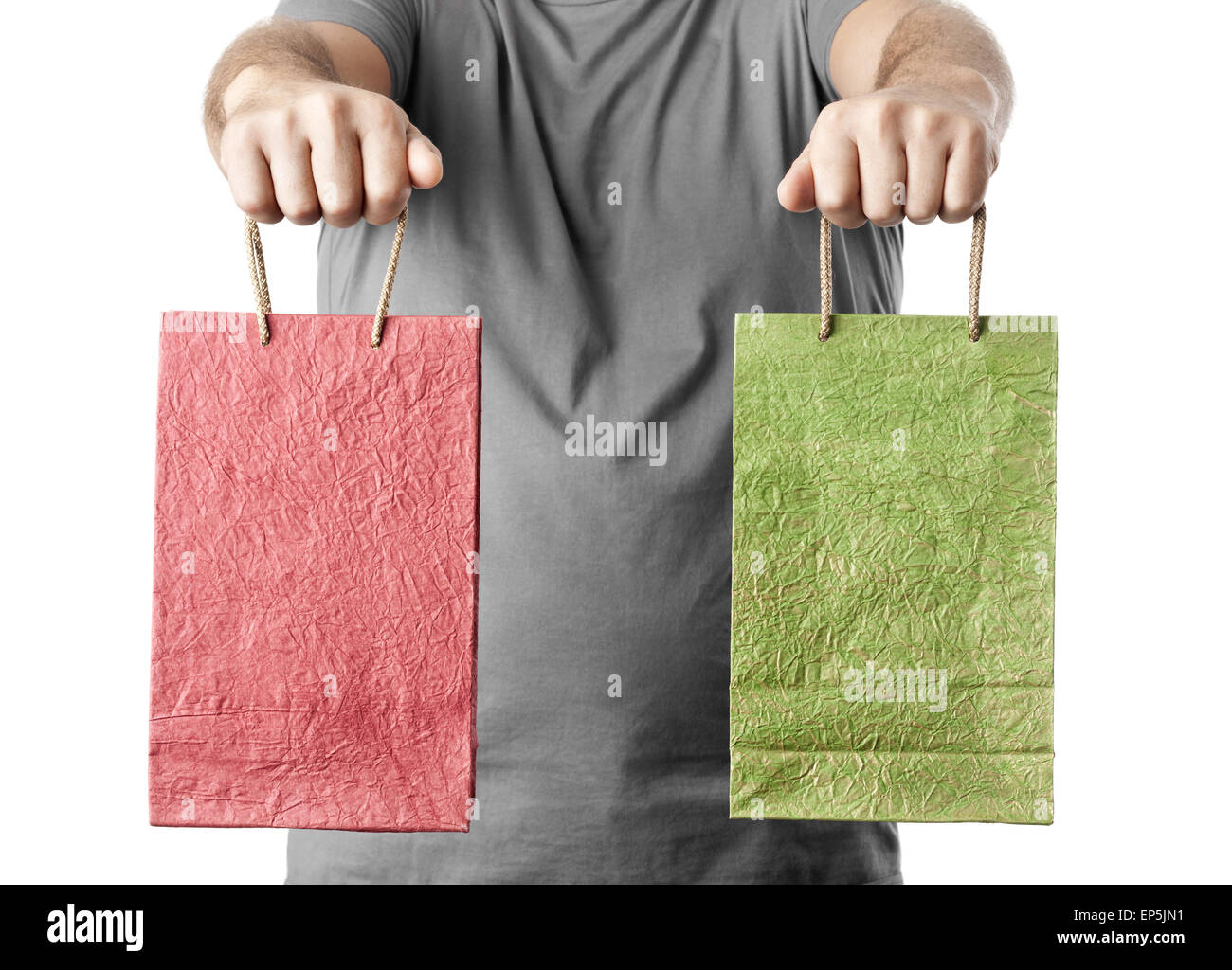 man holding two shopping bags isolated on white Stock Photo