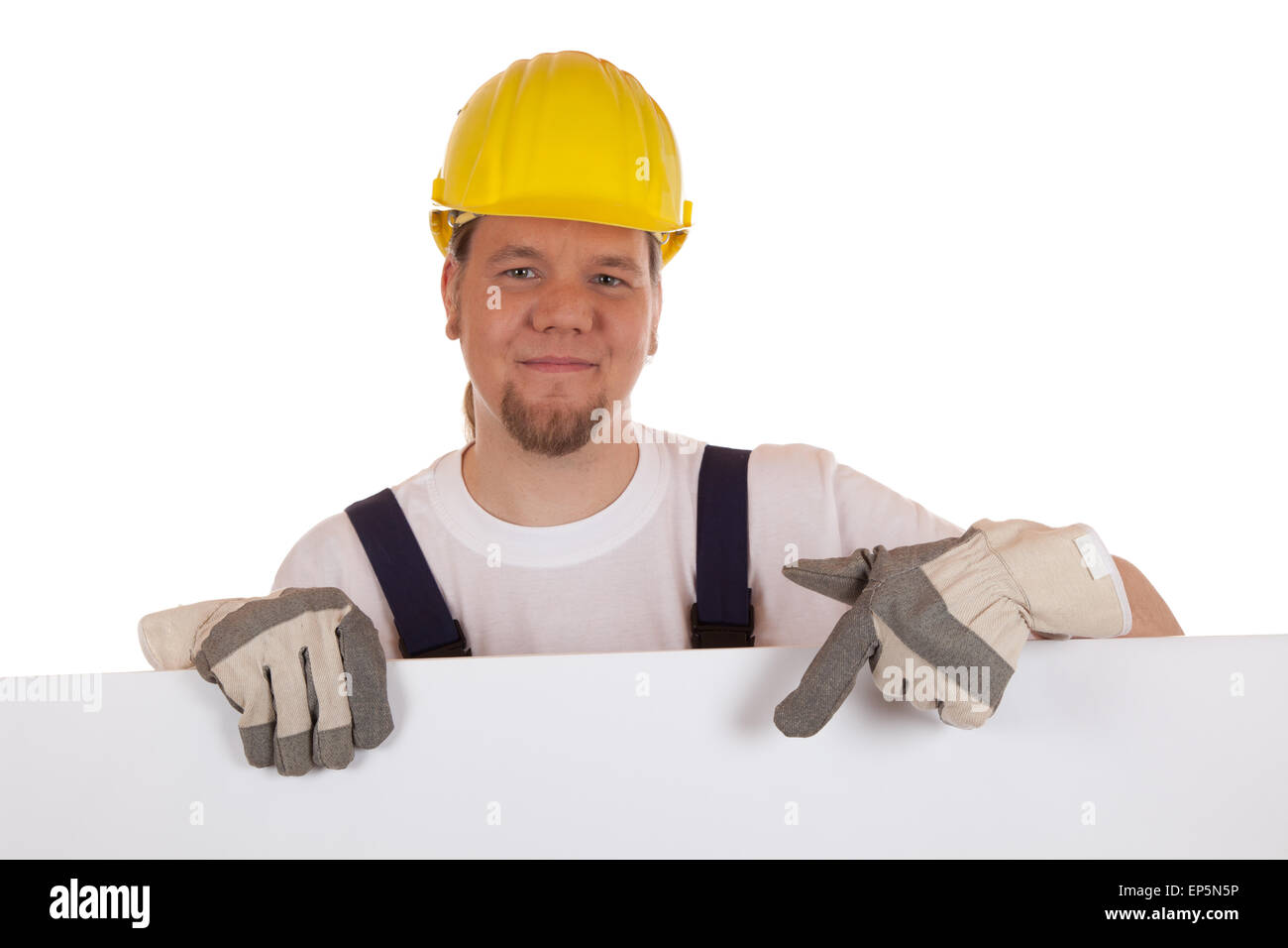 Bauarbeiter zeigt auf ein Schild Stock Photo