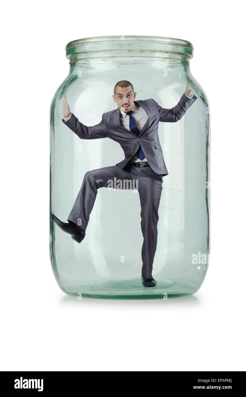 Young businessman in glass jar Stock Photo