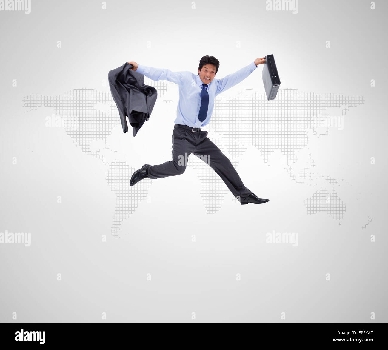 Businessman in suit jumping against background Stock Photo