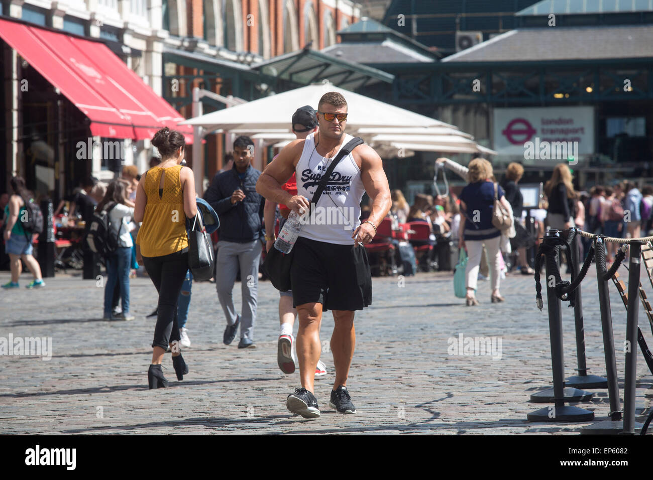 Beefcake muscle man singlet sunny Covent Garden Stock Photo