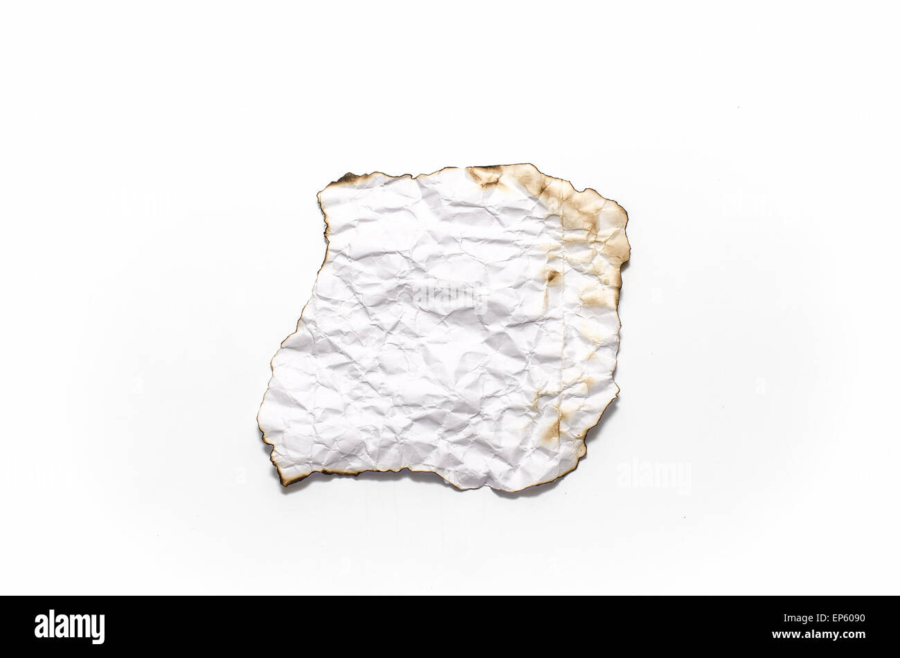 burn of crumpled paper on a white background Stock Photo