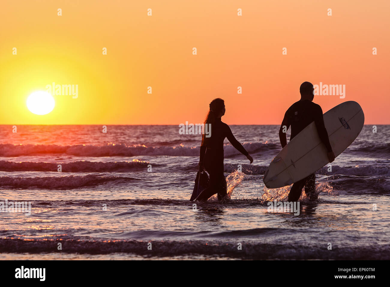 Surfers In The Water At Perran Sands Beach At Perranporth A Popular surfers-in-the-water-at-perran-sands-beach-at-perranporth-a-popular