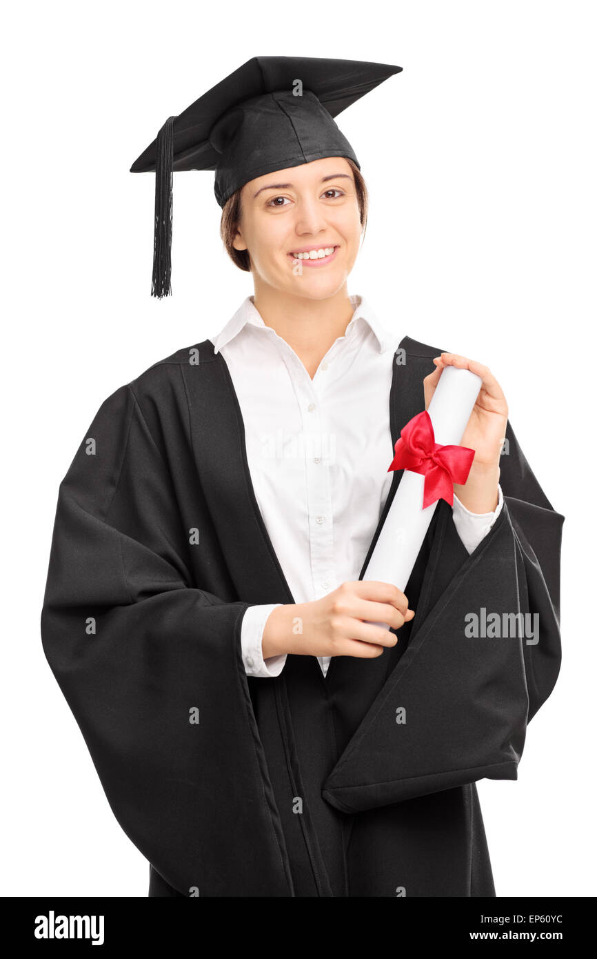 Vertical shot of a young woman in graduation gown posing with a diploma and looking at the camera isolated on white background Stock Photo