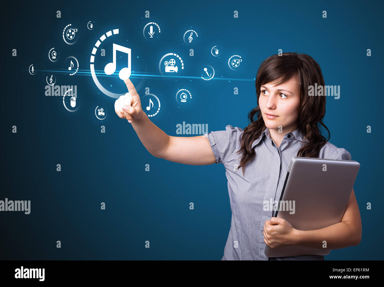 Businesswoman pressing virtual media type of buttons Stock Photo