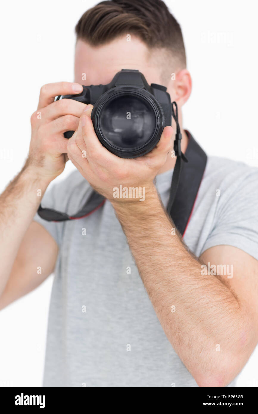 Young male photographer with photographic camera Stock Photo - Alamy