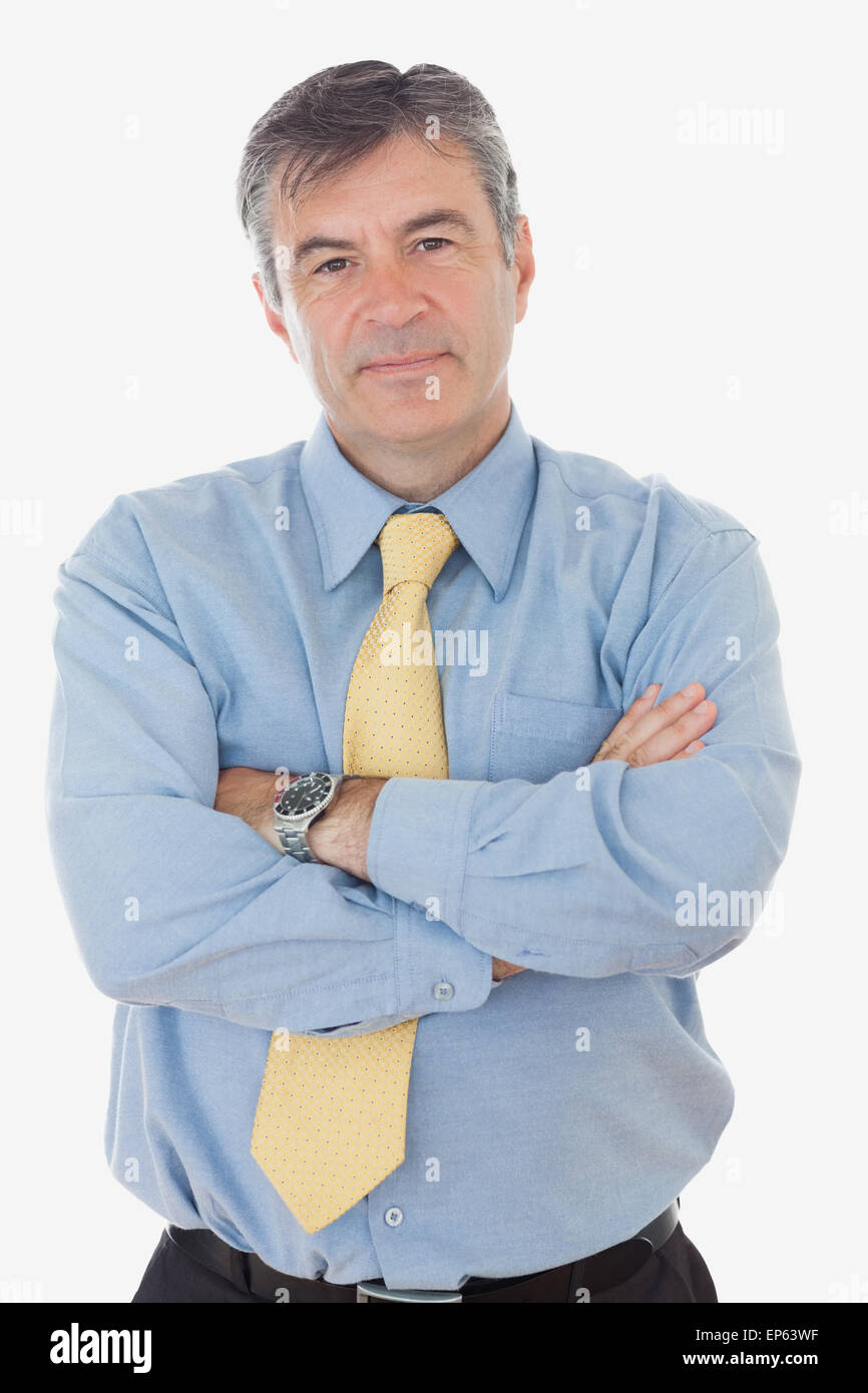 Portrait of mature businessman with arms crossed Stock Photo - Alamy