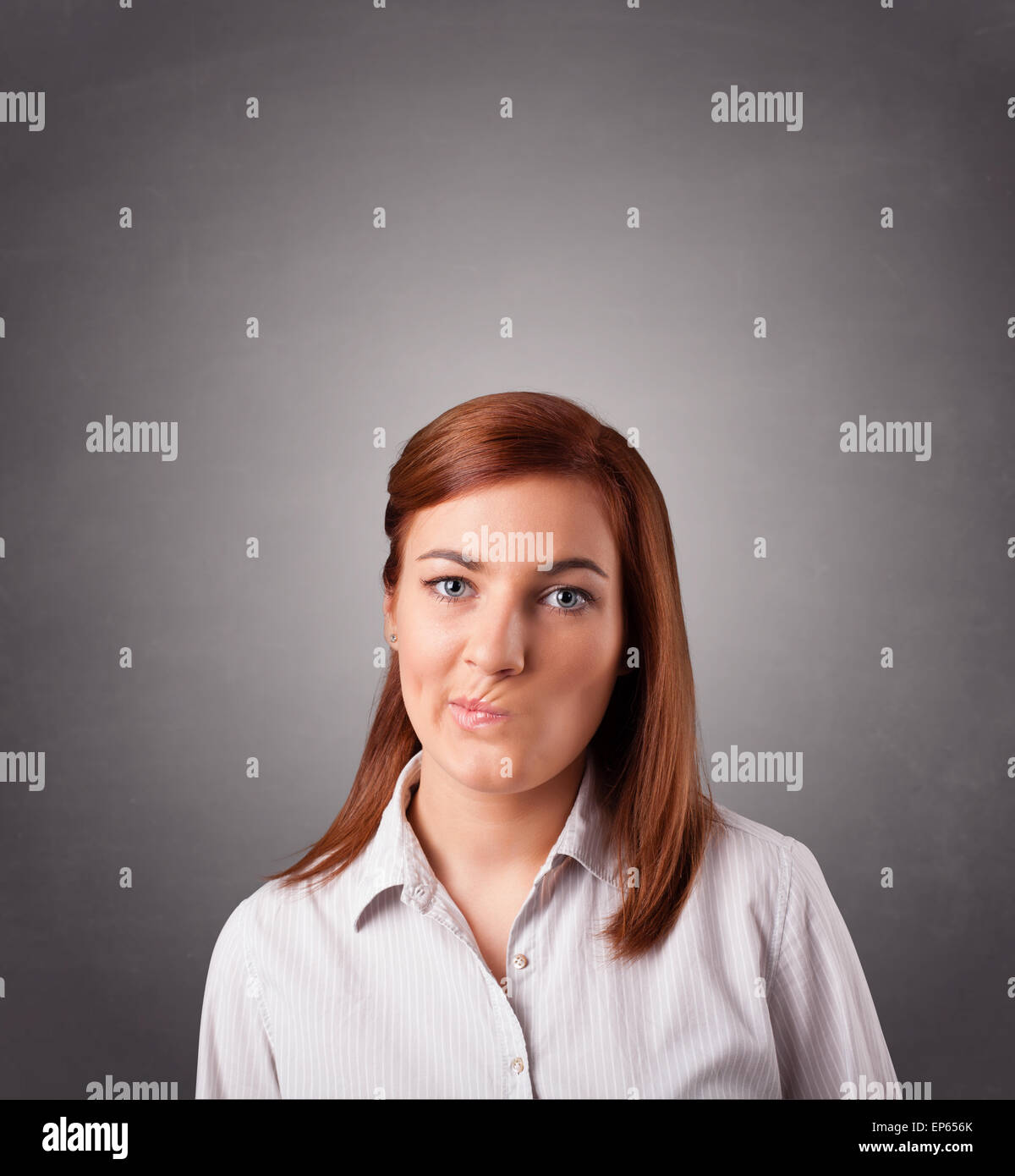 Young woman standing and thinking with copy space Stock Photo - Alamy