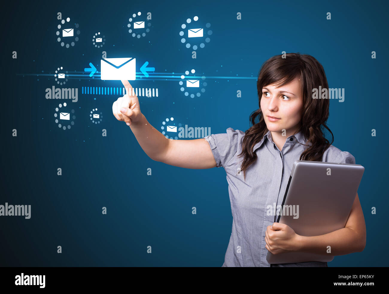 Businesswoman pressing virtual messaging type of icons Stock Photo