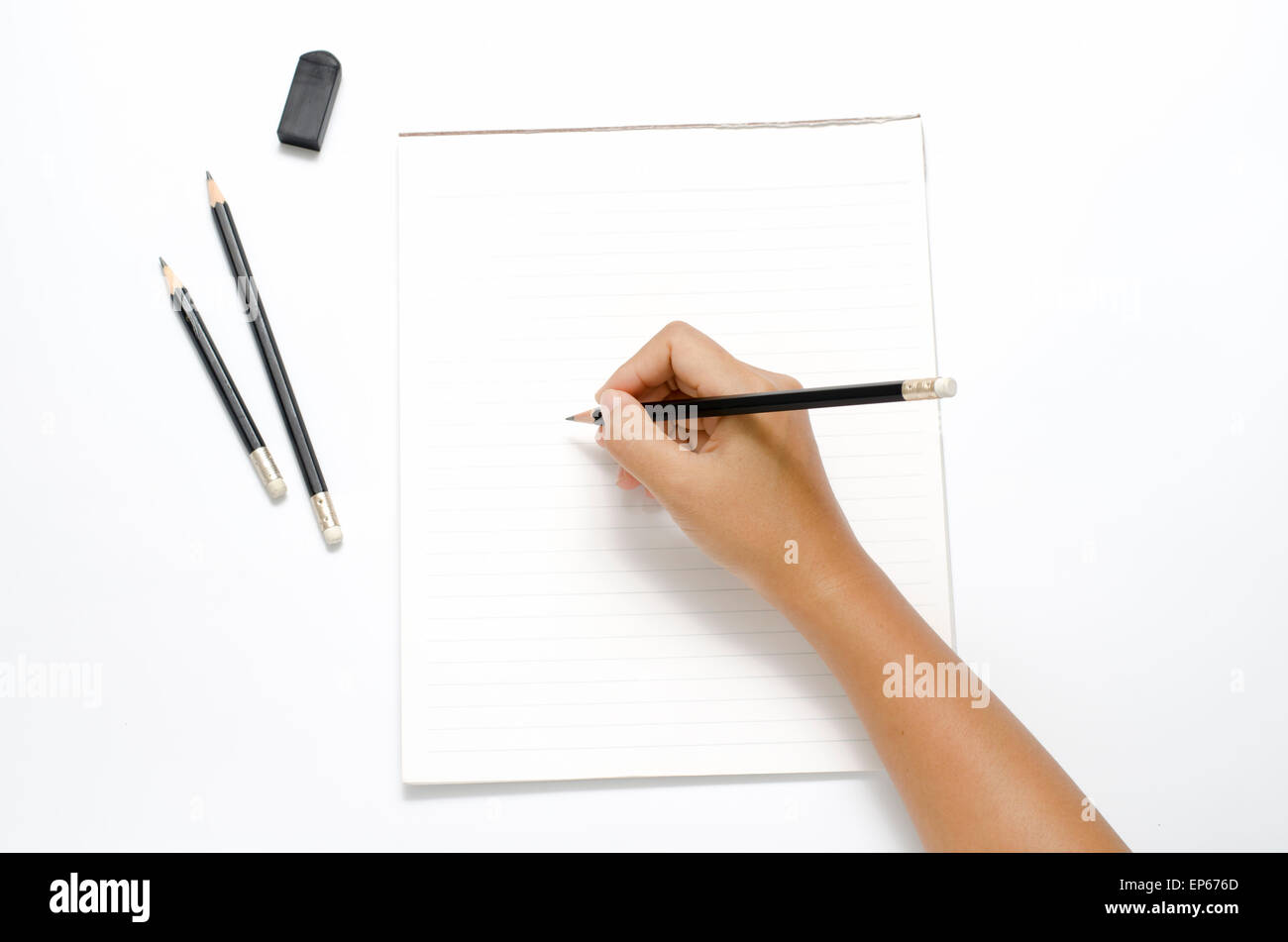 asia woman right hand writing with black pencil on paper over white