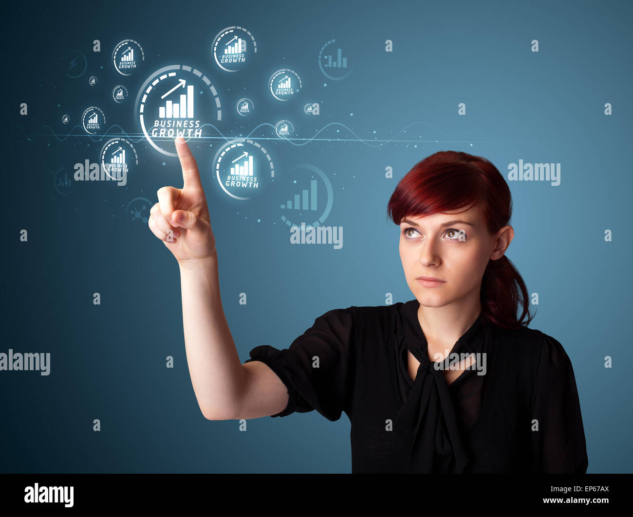 Businesswoman pressing modern business type of buttons Stock Photo