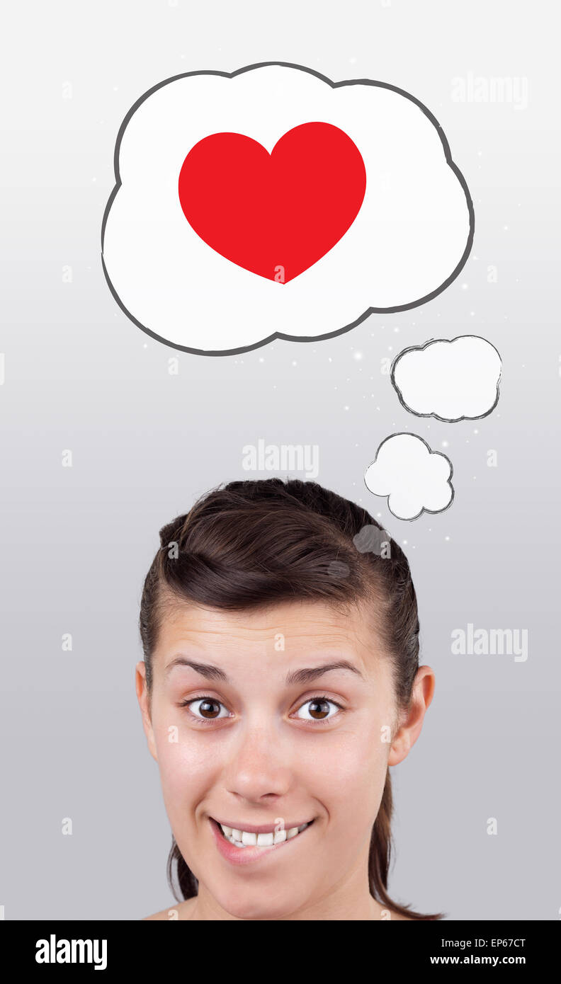 Young girl looking at love type of icons Stock Photo Alamy