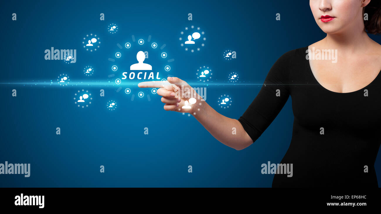Businesswoman pressing modern social type of icons Stock Photo