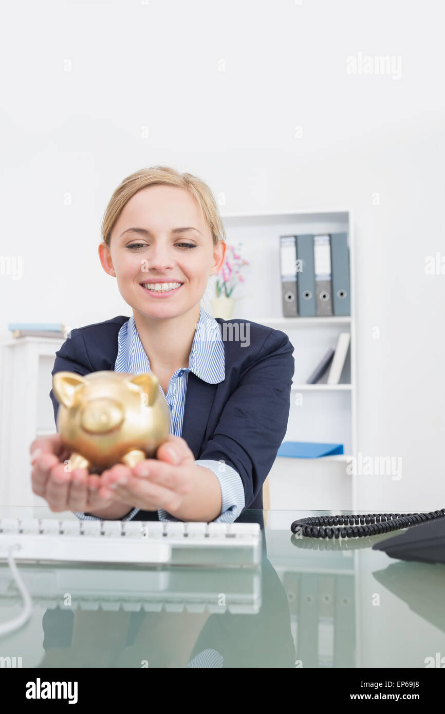 Smiling business woman with piggy bank office Stock Photo - Alamy
