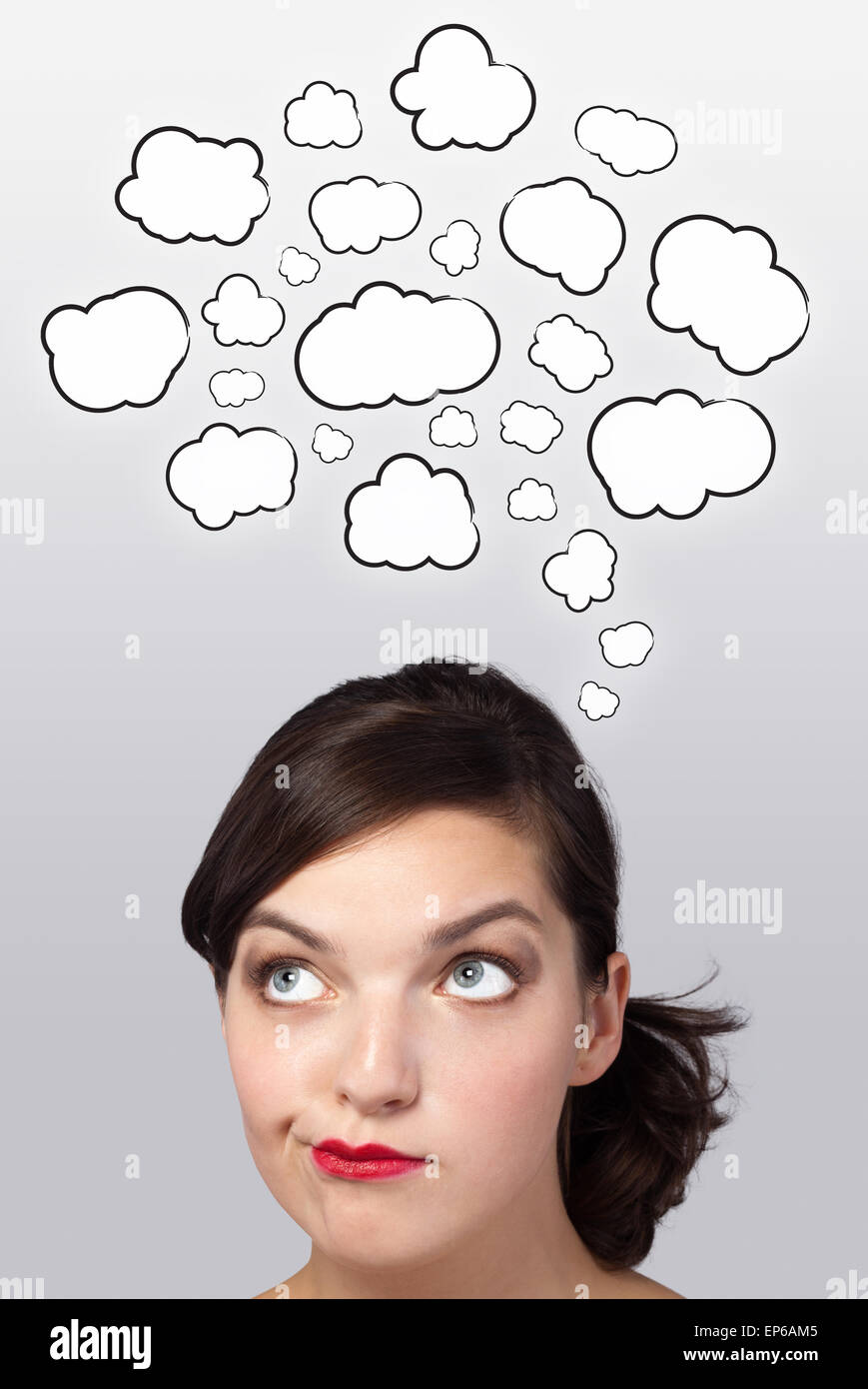 Young girl thinking with clouds Stock Photo - Alamy