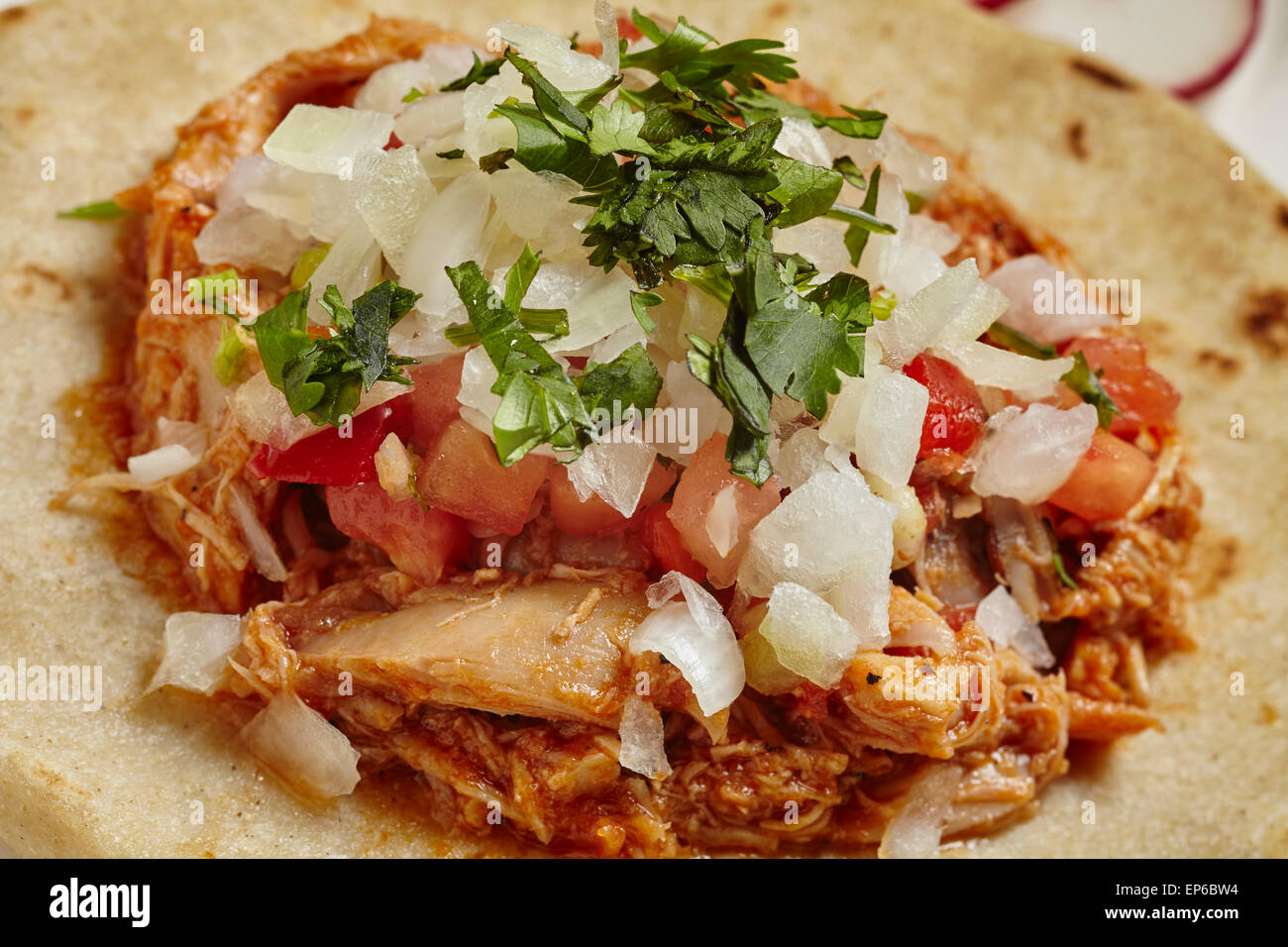 Chicken Sope, Mexican snack dish on a thick tortilla Stock Photo