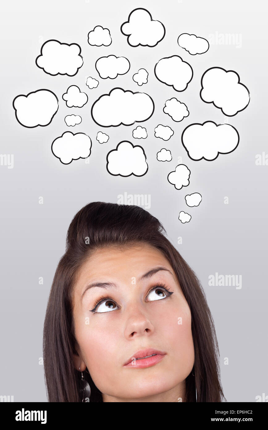 Young girl thinking with clouds Stock Photo - Alamy