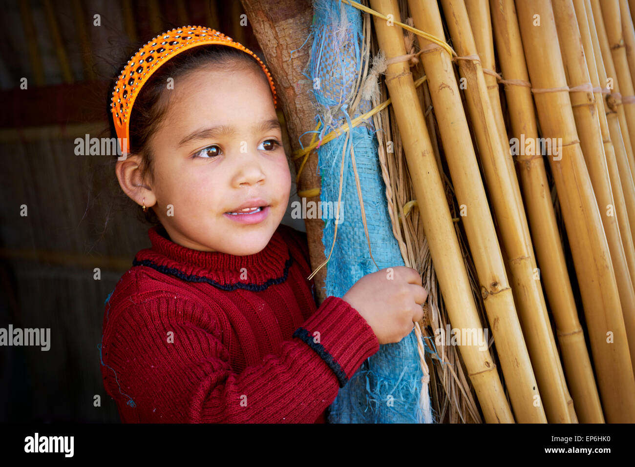 Portrait of a little Berber girl in village near Sahara desert. Morocco Stock Photo