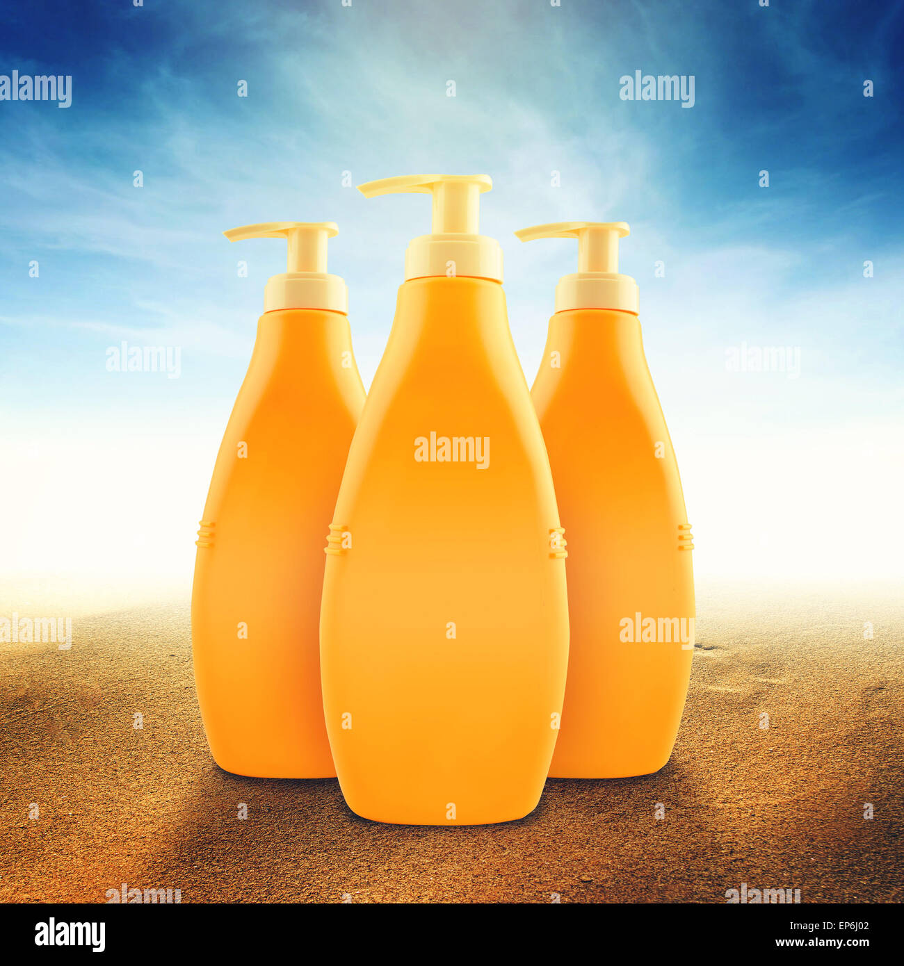 Suntan Lotion Bottles in Sand on Sunny Seaside Beach as Blank Copy Space for text or graphics Stock Photo