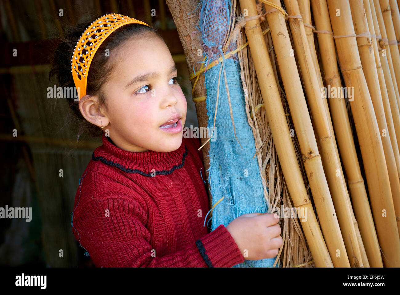 Portrait of a little Berber girl in village near Sahara desert. Morocco Stock Photo